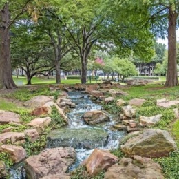 The essence of exceptional living creek running trough trees